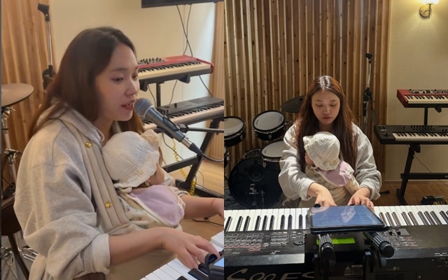 이진아가 아기띠를 두르고 합주하는 장면